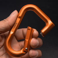hand holding orange betalock on black background