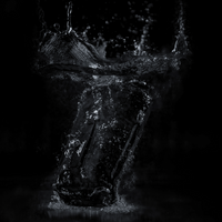 Dry bag splashing into water with black background