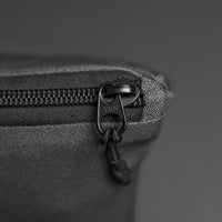 close up view of YKK zipper on packed up beach towel