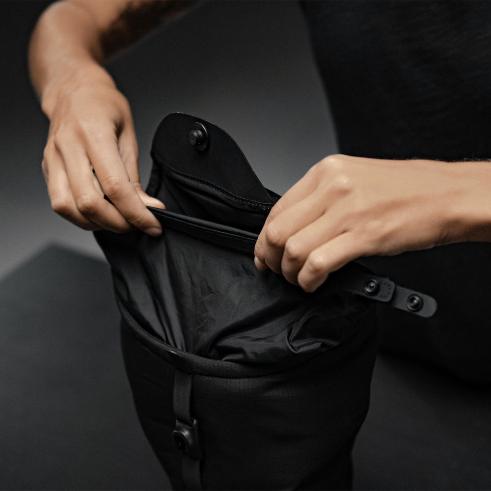 Hands rolling down waterproof drybag liner