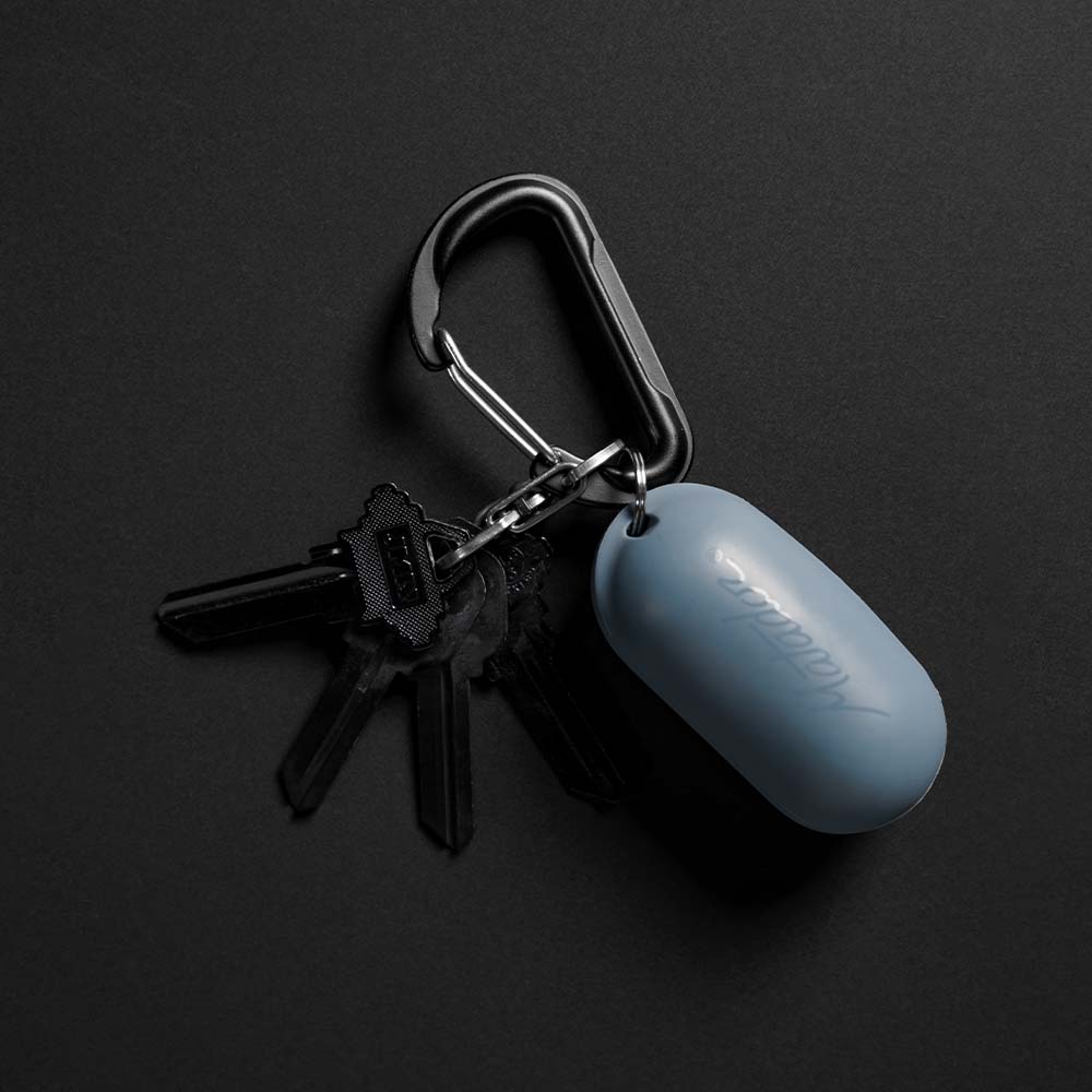 Blue Droplet silicone case connected to black carabiner on black background
