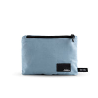Packed up slate blue towel on white background