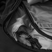 Close up view of keys hanging from internal backpack pocket