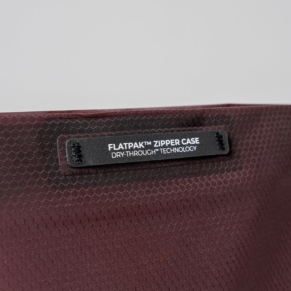 close up view of garnet zipper toiletry case hand loop