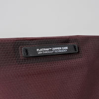 close up view of garnet zipper toiletry case hand loop