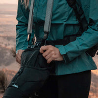 Woman placing camera into base layer
