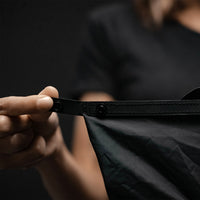 Close up view of hands displaying snap buttons