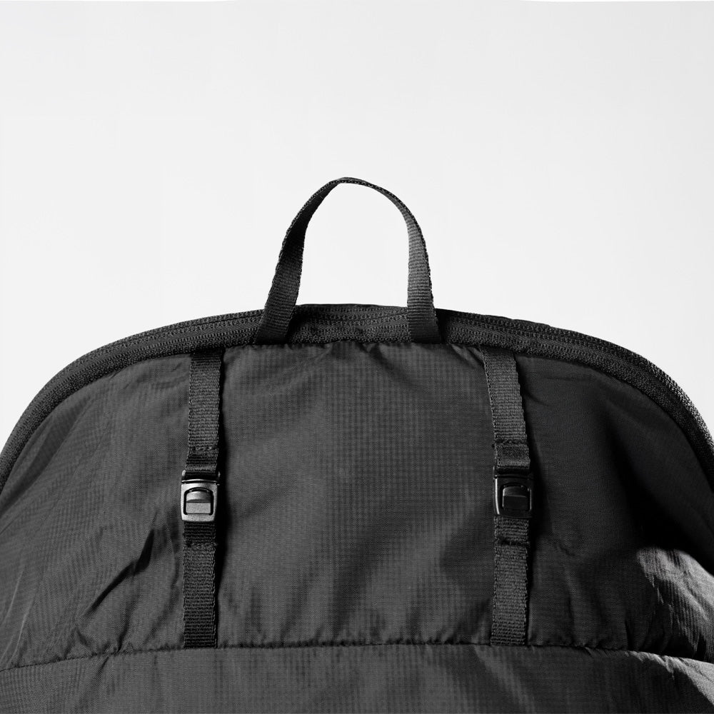 Detail view of rod clips on the back panel of the laundry bag