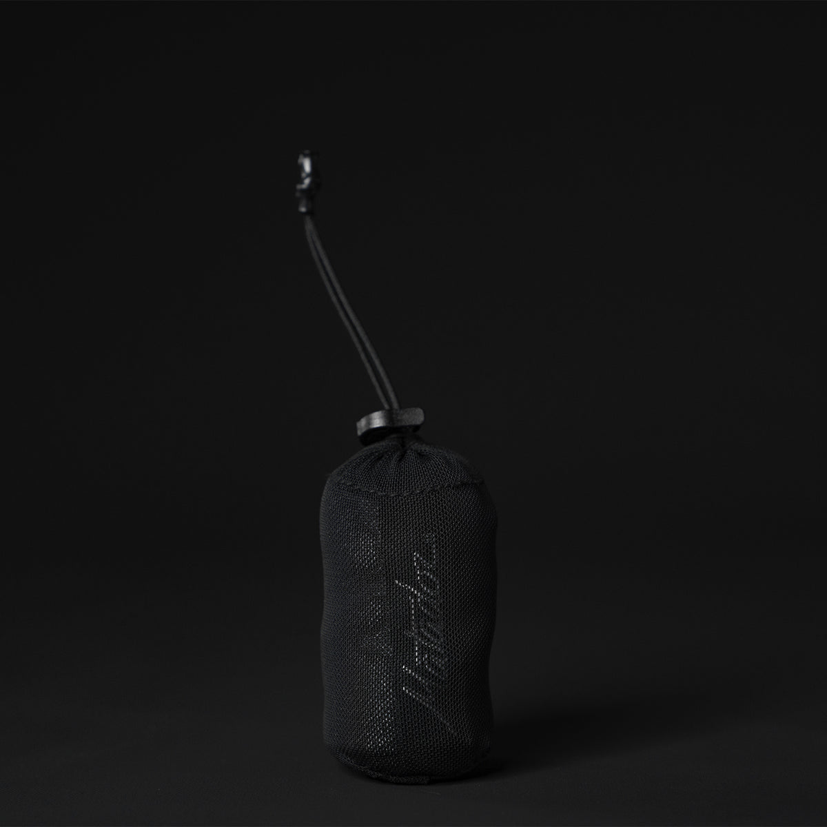 View of packed up towel pouch on black background