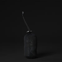 View of packed up towel pouch on black background