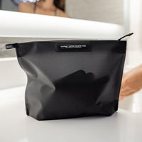 Flatpack zipper case sitting on sink edge