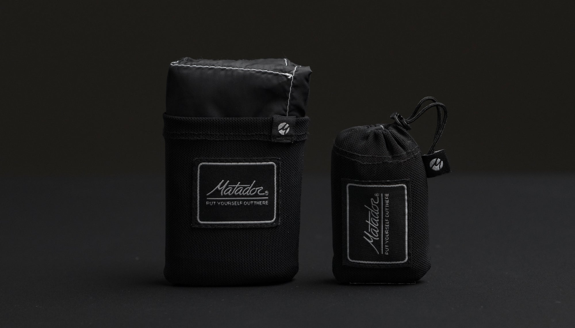Black pocket blanket and pocket blanket mini on black background